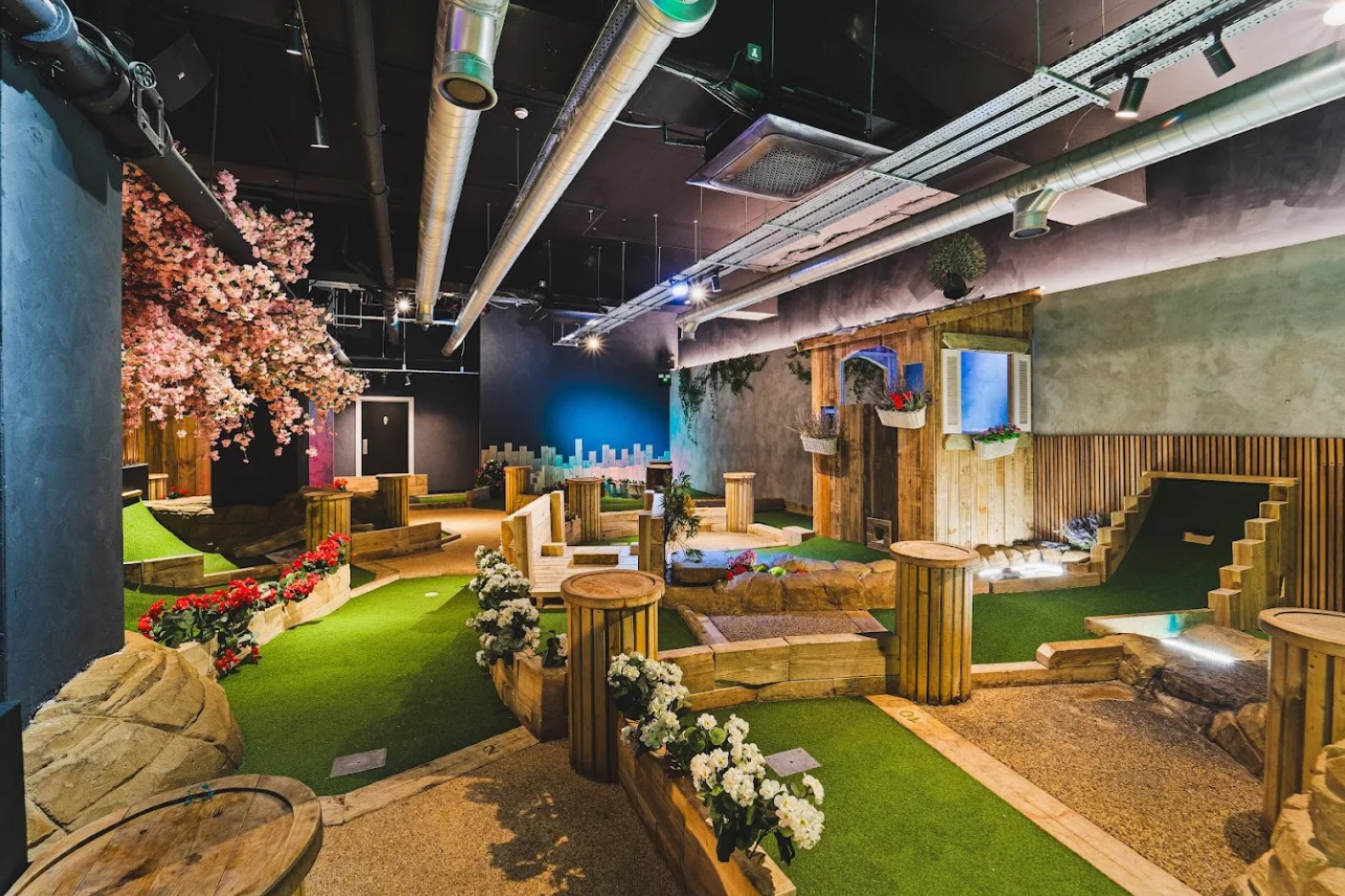 Garden-themed crazy golf course indoors at Spinners